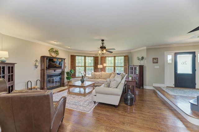 26 Carriage House Ln, Orland Park, IL 60467 - living area featuring ceiling fan, dark wood-style flooring, a glass covered fireplace, and ornamental molding
