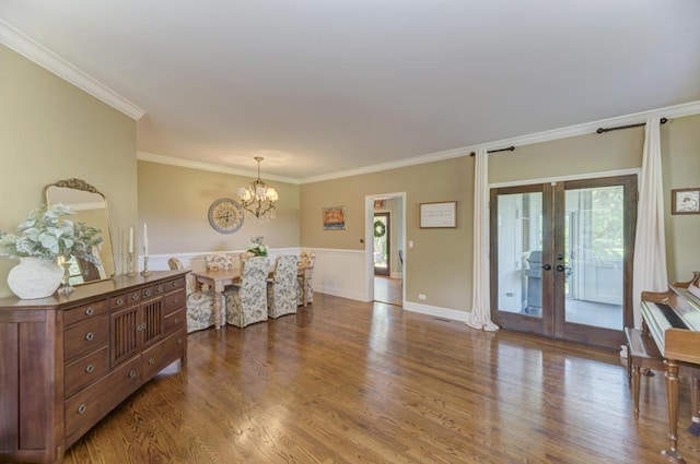 26 Carriage House Ln, Orland Park, IL 60467 - living area featuring french doors, a chandelier, crown molding, and wood finished floors
