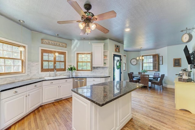 26 Carriage House Ln, Orland Park, IL 60467 - kitchen with dishwasher, light wood-type flooring, white cabinetry, backsplash, and a textured ceiling