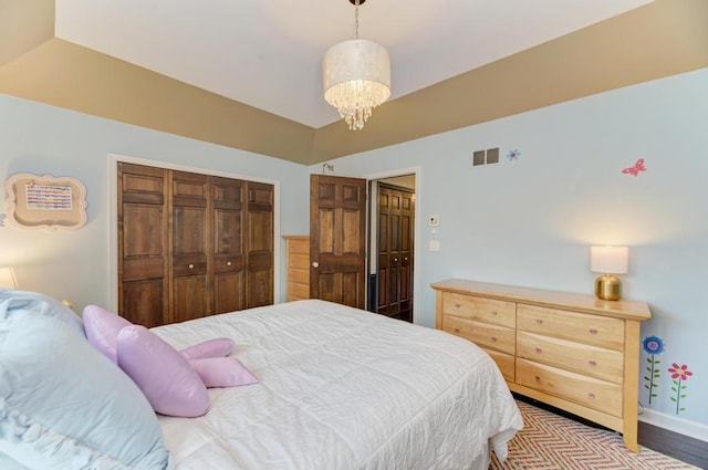 26 Carriage House Ln, Orland Park, IL 60467 - bedroom featuring a closet, wood finished floors, and a chandelier