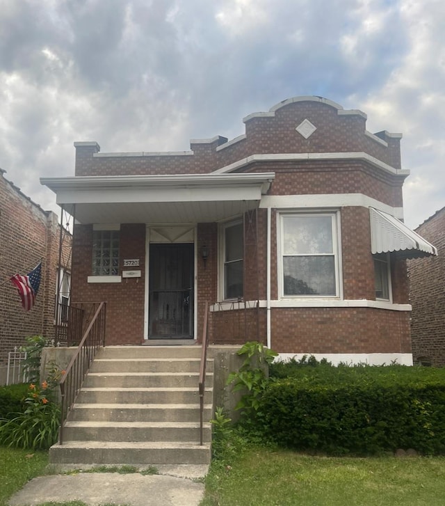 5720 W 23rd St, Cicero, IL 60804 - view of front facade featuring brick siding and covered porch