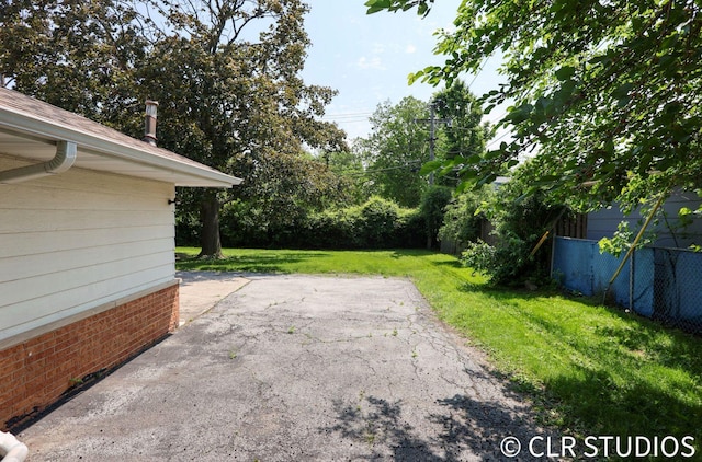17405 Longfellow Ave, Hazel Crest, IL 60429 - view of grassy yard featuring a patio