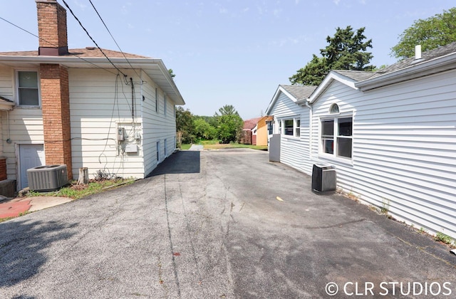 17405 Longfellow Ave, Hazel Crest, IL 60429 - exterior space featuring a chimney and a central air condition unit