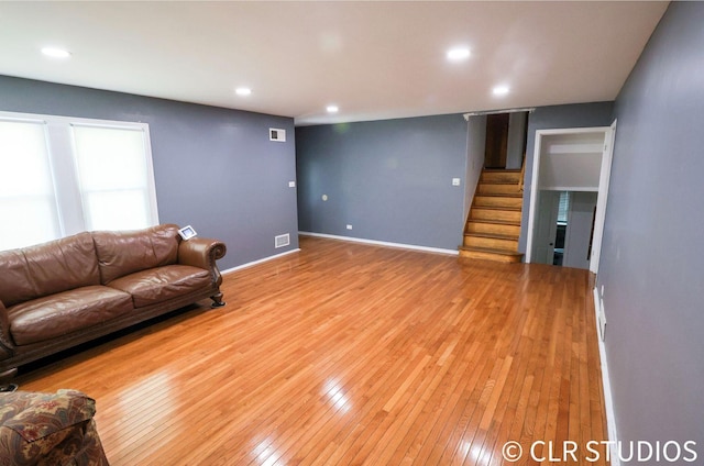 17405 Longfellow Ave, Hazel Crest, IL 60429 - living room with light wood-type flooring, stairway, and recessed lighting