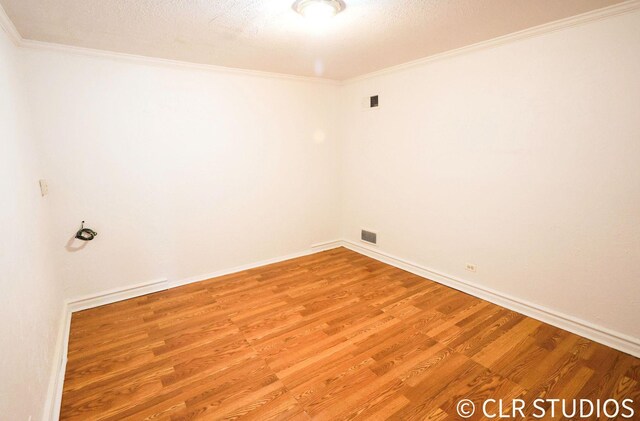 17405 Longfellow Ave, Hazel Crest, IL 60429 - spare room with light wood finished floors and crown molding