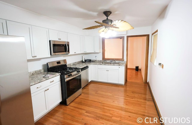 17405 Longfellow Ave, Hazel Crest, IL 60429 - kitchen featuring appliances with stainless steel finishes, white cabinets, light wood-style floors, and a ceiling fan
