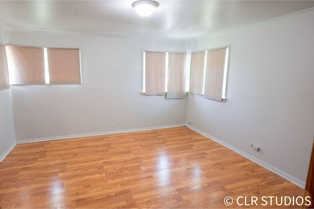 17405 Longfellow Ave, Hazel Crest, IL 60429 - unfurnished room with crown molding and light wood-style floors
