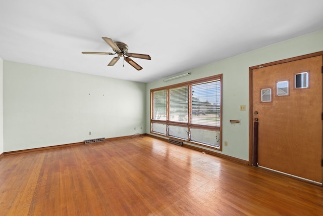 345 W Jeffery St, Kankakee, IL 60901 - unfurnished living room with a ceiling fan and wood finished floors