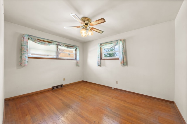 345 W Jeffery St, Kankakee, IL 60901 - empty room with light wood-style floors and a ceiling fan