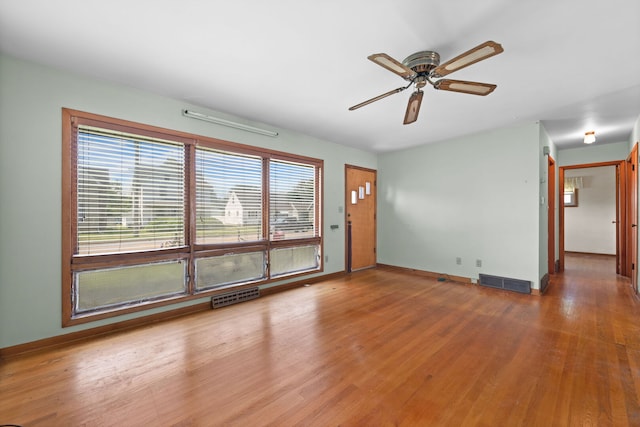 345 W Jeffery St, Kankakee, IL 60901 - unfurnished living room featuring ceiling fan and wood finished floors