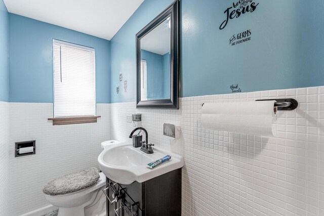 1820 Maple Ave, Berwyn, IL 60402 - bathroom with tile walls and a wainscoted wall