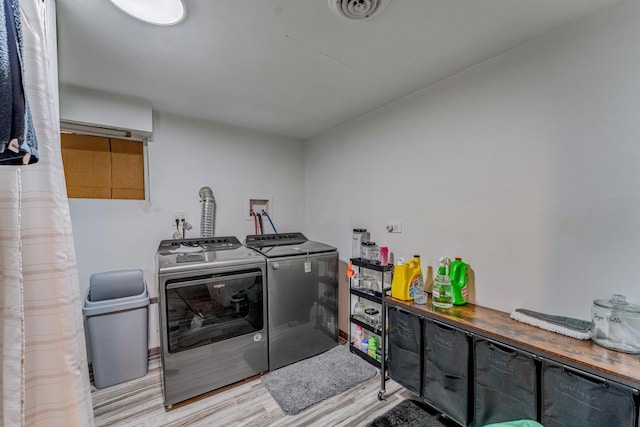 1820 Maple Ave, Berwyn, IL 60402 - washroom with washing machine and dryer and wood finished floors