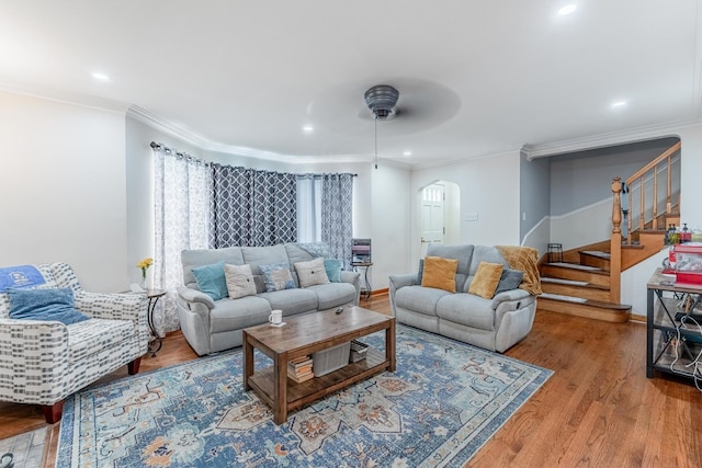 1820 Maple Ave, Berwyn, IL 60402 - living area with arched walkways, stairway, a ceiling fan, wood finished floors, and ornamental molding