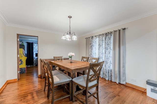 1820 Maple Ave, Berwyn, IL 60402 - dining room featuring ornamental molding, light wood-type flooring, and a chandelier
