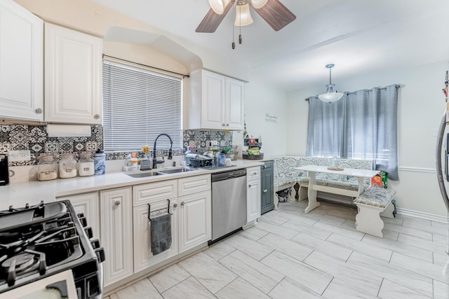 1820 Maple Ave, Berwyn, IL 60402 - kitchen with dishwasher, range with gas stovetop, a ceiling fan, decorative backsplash, and light countertops