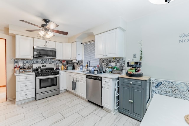 1820 Maple Ave, Berwyn, IL 60402 - kitchen featuring stainless steel appliances, ceiling fan, light countertops, and white cabinetry