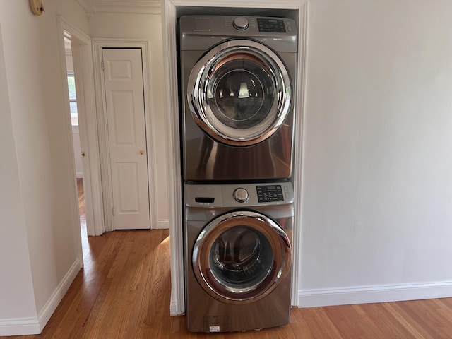 11133 Boeger Ct, Westchester, IL 60154 - laundry area with stacked washer and clothes dryer and wood finished floors