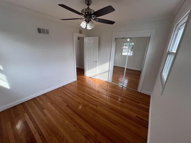 11133 Boeger Ct, Westchester, IL 60154 - unfurnished bedroom with wood finished floors, a closet, and a ceiling fan