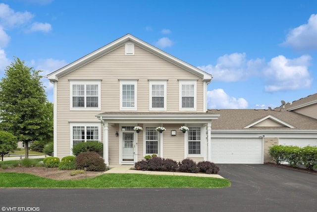 142 W Park Ave Unit C, Sugar Grove, IL 60554 - traditional-style house featuring driveway, a garage, and a porch