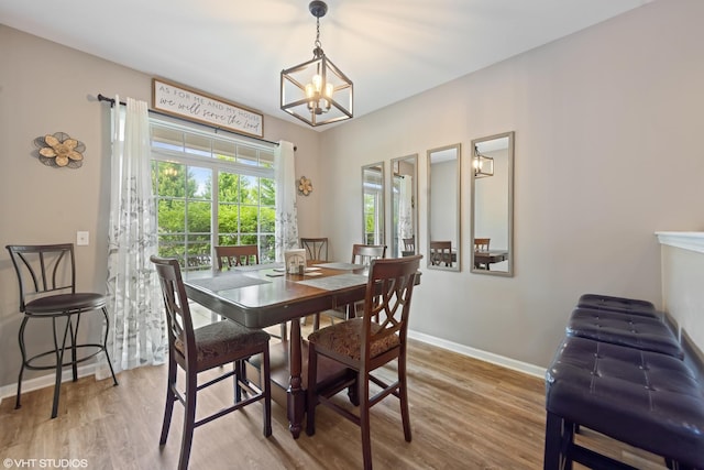 142 W Park Ave Unit C, Sugar Grove, IL 60554 - dining space featuring a chandelier and light wood-style flooring