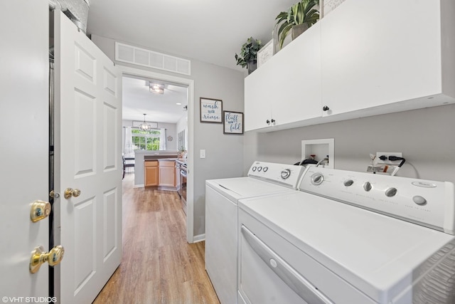142 W Park Ave Unit C, Sugar Grove, IL 60554 - washroom featuring cabinet space, independent washer and dryer, and light wood-type flooring