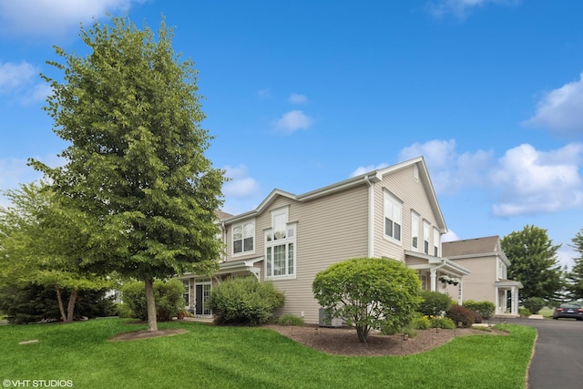 142 W Park Ave Unit C, Sugar Grove, IL 60554 - view of side of home featuring a yard