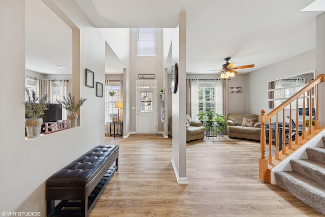 142 W Park Ave Unit C, Sugar Grove, IL 60554 - entrance foyer with light wood-type flooring, stairway, and ceiling fan