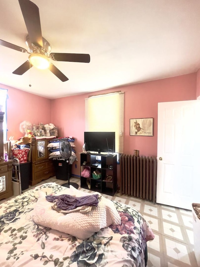2632 S Austin Blvd, Cicero, IL 60804 - bedroom featuring radiator, ceiling fan, and tile patterned floors