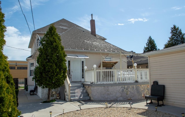 2632 S Austin Blvd, Cicero, IL 60804 - back of property featuring a chimney and roof with shingles