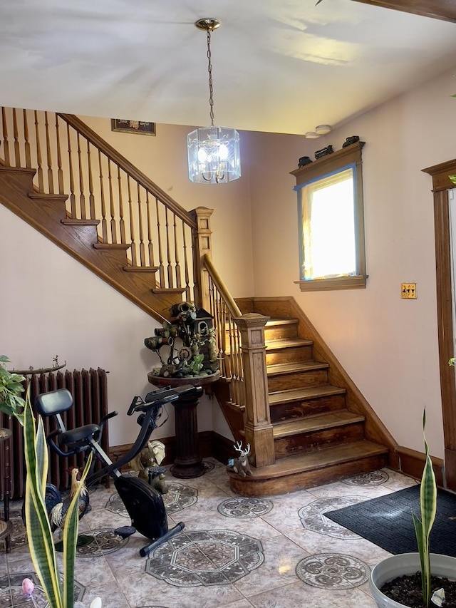 2632 S Austin Blvd, Cicero, IL 60804 - stairs with baseboards and a chandelier