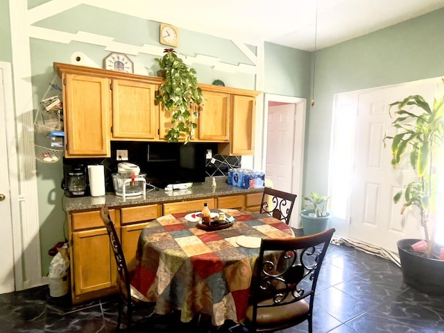 2632 S Austin Blvd, Cicero, IL 60804 - kitchen featuring tasteful backsplash, dark tile patterned floors, light brown cabinets, and dark countertops