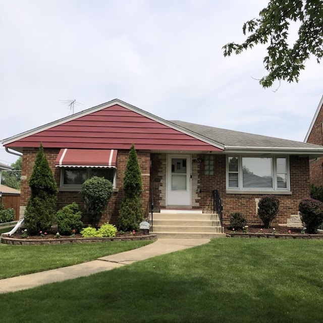 1525 Morgan Ave, La Grange Park, IL 60526 - view of front facade with brick siding and a front lawn