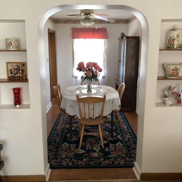 1525 Morgan Ave, La Grange Park, IL 60526 - dining space featuring arched walkways, ceiling fan, wood finished floors, and built in features