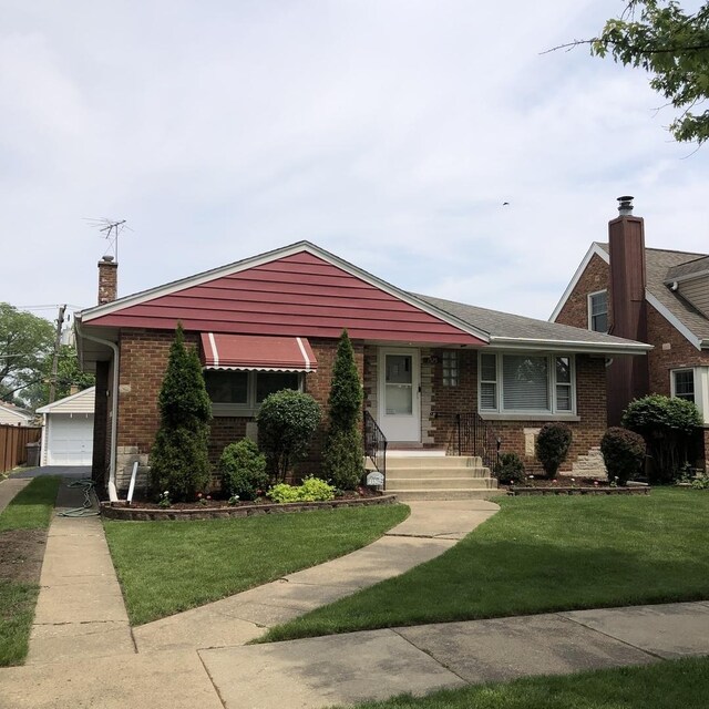 1525 Morgan Ave, La Grange Park, IL 60526 - view of front facade with a chimney, brick siding, a front yard, and a detached garage