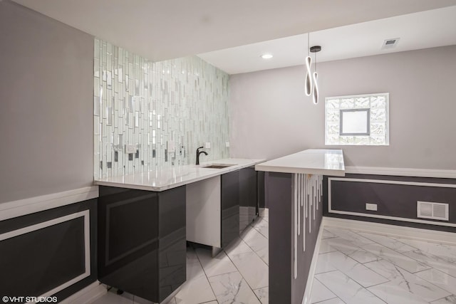 11616 S Lowe Ave, Chicago, IL 60628 - bar area featuring recessed lighting, hanging light fixtures, and light marble finish flooring