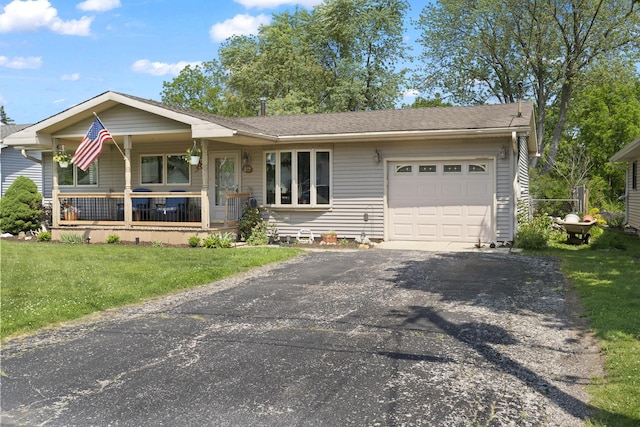 277 Mcmillan St, Grayslake, IL 60030 - view of front facade featuring a garage, covered porch, a front lawn, and asphalt driveway