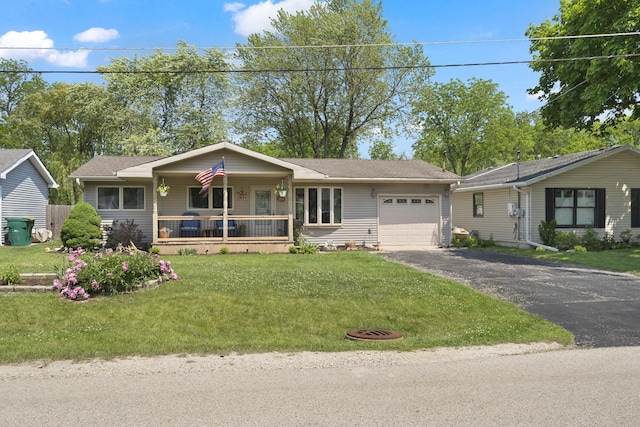 277 Mcmillan St, Grayslake, IL 60030 - single story home featuring covered porch, a garage, asphalt driveway, and a front yard