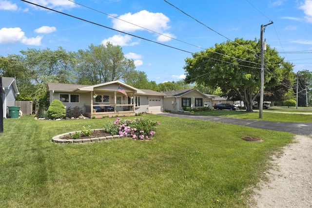 277 Mcmillan St, Grayslake, IL 60030 - ranch-style home with an attached garage, a porch, and asphalt driveway
