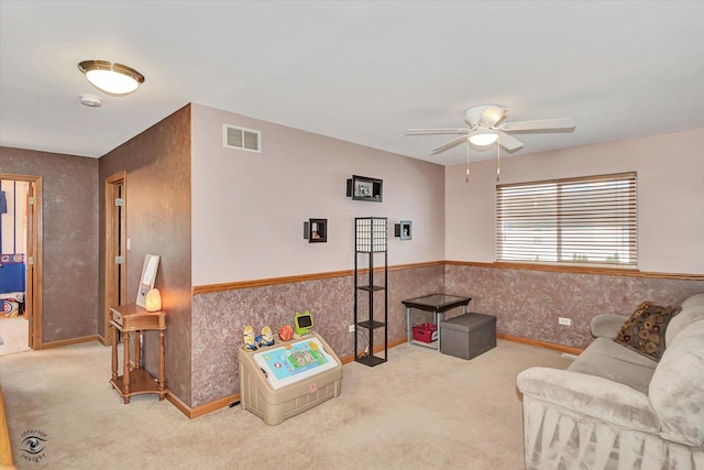1612 Whisper Glen Dr, Plainfield, IL 60586 - living area featuring carpet, a ceiling fan, wainscoting, and wallpapered walls
