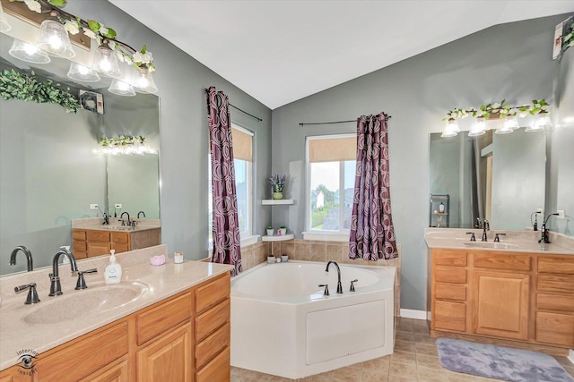 1612 Whisper Glen Dr, Plainfield, IL 60586 - full bathroom featuring lofted ceiling, a bath, two vanities, and tile patterned flooring