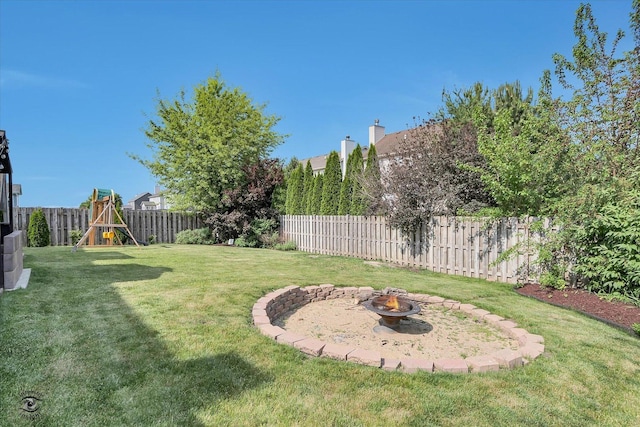 1612 Whisper Glen Dr, Plainfield, IL 60586 - fenced backyard with an outdoor fire pit and a playground