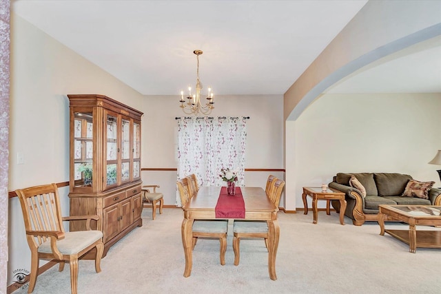 1612 Whisper Glen Dr, Plainfield, IL 60586 - dining room with arched walkways, a chandelier, and light carpet