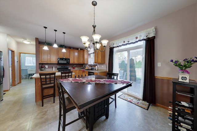1612 Whisper Glen Dr, Plainfield, IL 60586 - dining space featuring a chandelier and baseboards