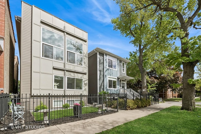 2503 N Maplewood Ave, Chicago, IL 60647 - view of building exterior with a fenced front yard
