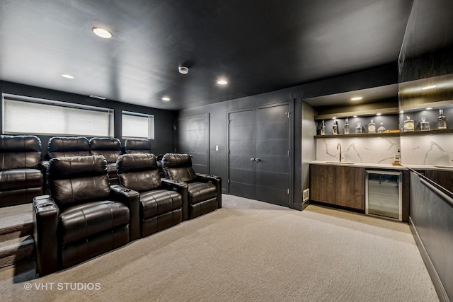 2503 N Maplewood Ave, Chicago, IL 60647 - home theater featuring light colored carpet, beverage cooler, bar with sink, and recessed lighting