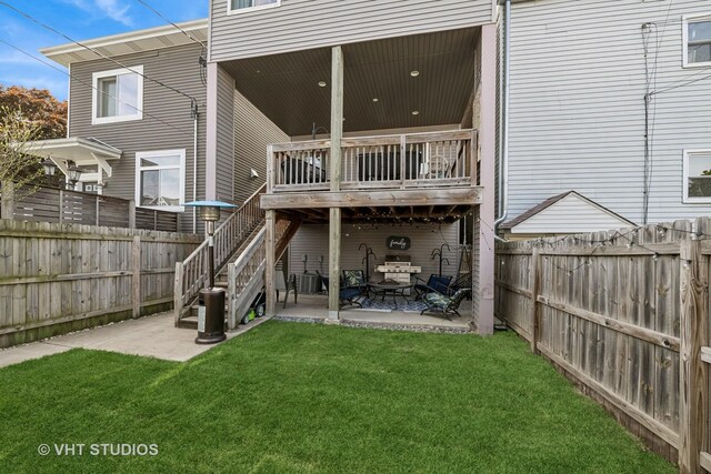 2503 N Maplewood Ave, Chicago, IL 60647 - back of property with a fenced backyard, a patio, and stairs