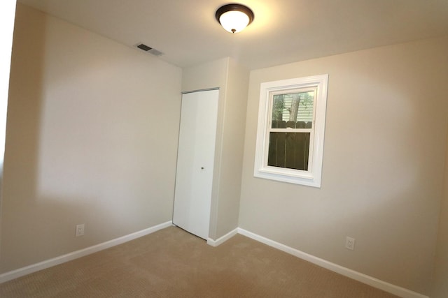 123 E Pineview Dr, Round Lake Park, IL 60073 - unfurnished bedroom with a closet and light carpet