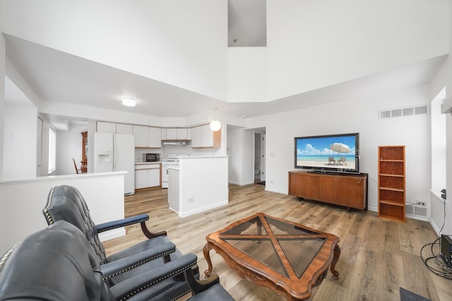 1678 Penny Ln, Bartlett, IL 60103 - living room with light wood-type flooring and a towering ceiling