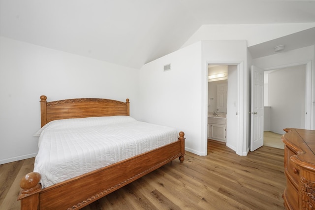 1678 Penny Ln, Bartlett, IL 60103 - bedroom featuring wood finished floors, vaulted ceiling, and ensuite bathroom