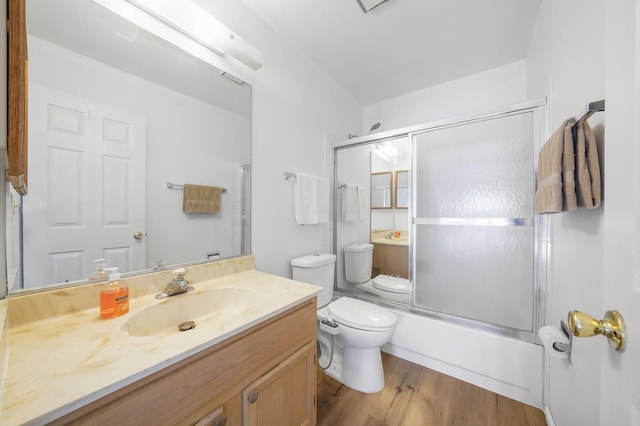 1678 Penny Ln, Bartlett, IL 60103 - full bathroom with vanity, enclosed tub / shower combo, and wood finished floors